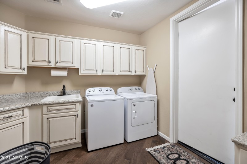 Laundry with sink and cabinets
