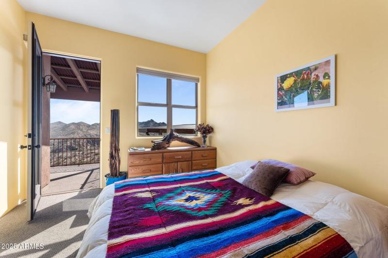 Room with walk in closet and full bath