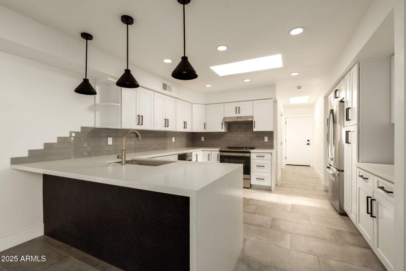 Kitchen with Sleek Waterfall Countertops