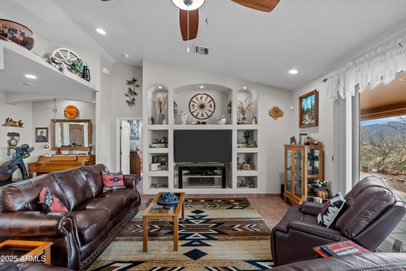 Entertainment Center holds a 65" TV