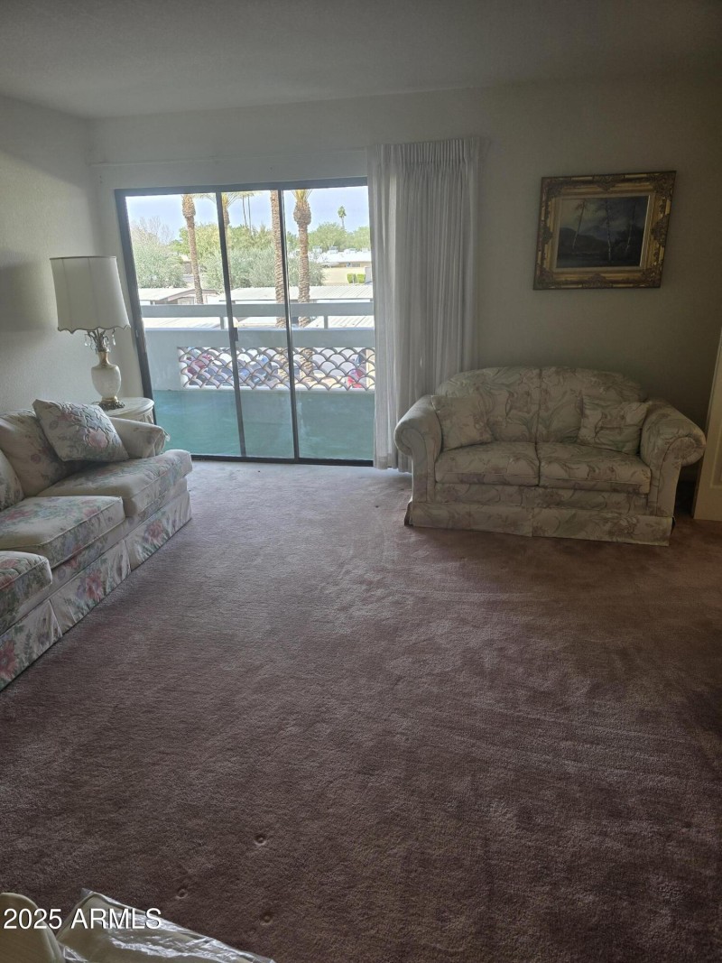 LIVING ROOM OUT TO BALCONY