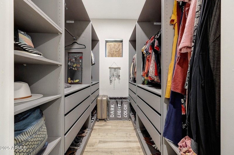 Primary closet 1 of 2 with organizers