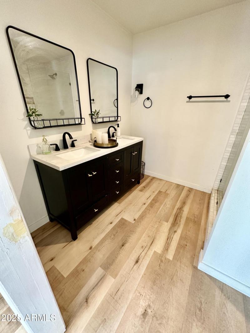 Primary bathroom with dual vanities