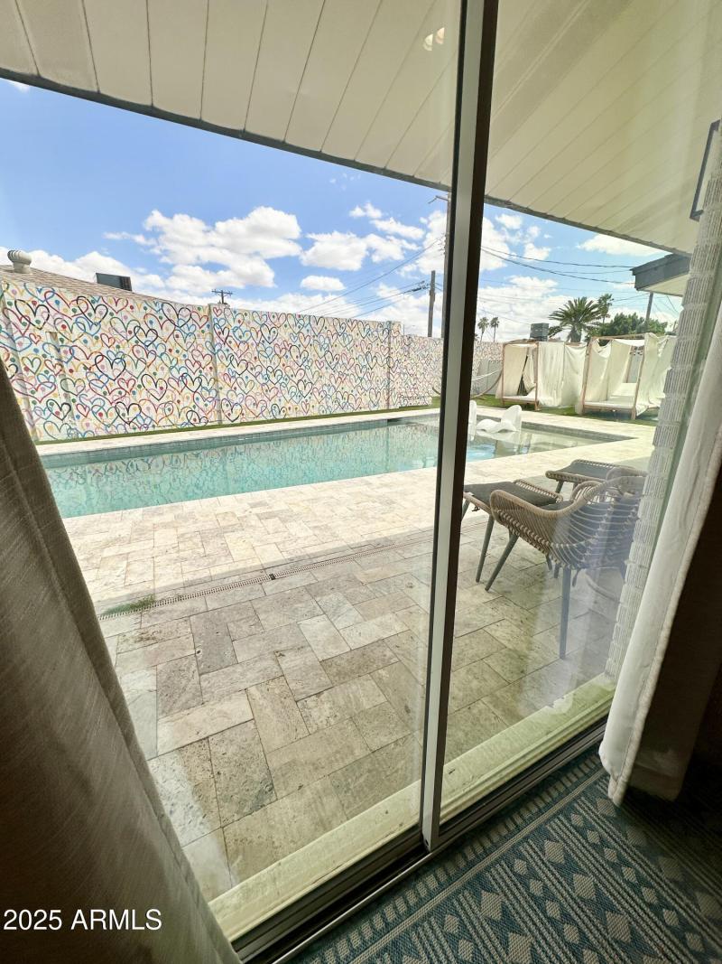 Primary Bedroom French Door To Backyard