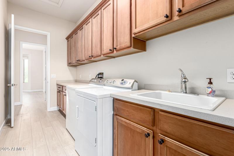 Large Laundry w sink and Cabinets