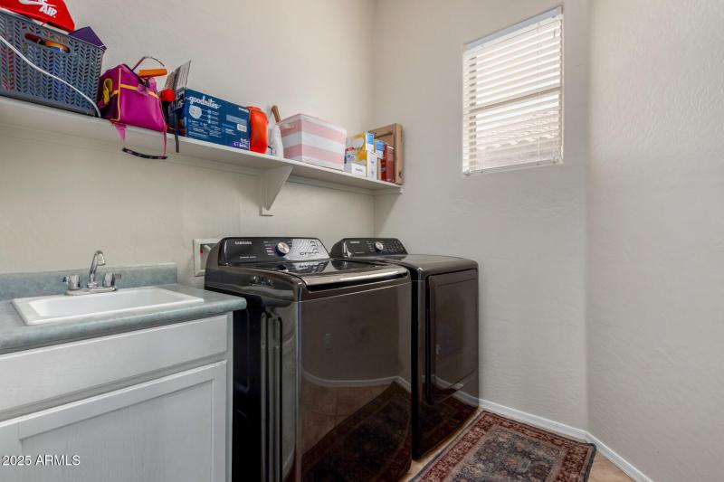 Large laundry room with utility sink
