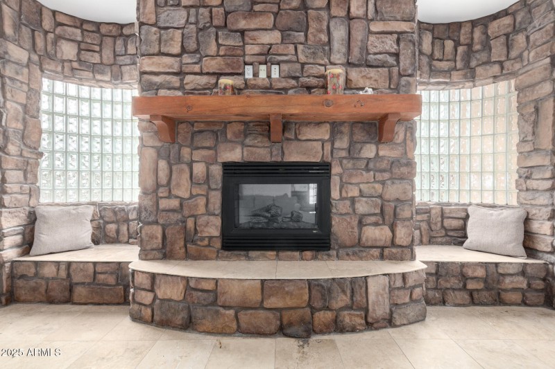 Grand Stone Fireplace With Seating