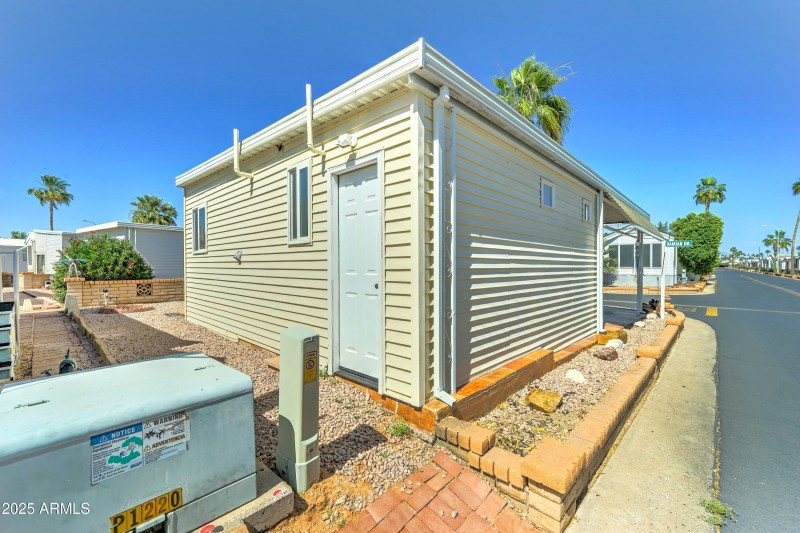 Storage shed at rear of home