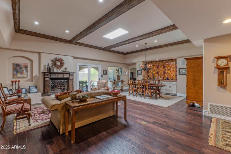 Living/dining overlooks patio/pool