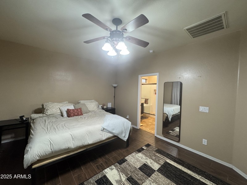 Master bedroom with tile floor