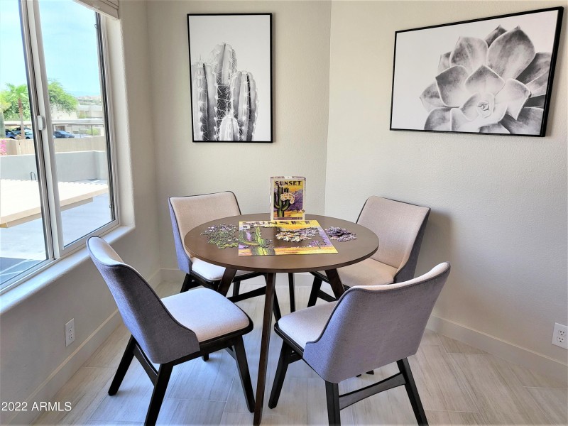 dining with front window view of The Fou