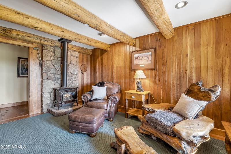 Den with wood beam ceiling accents