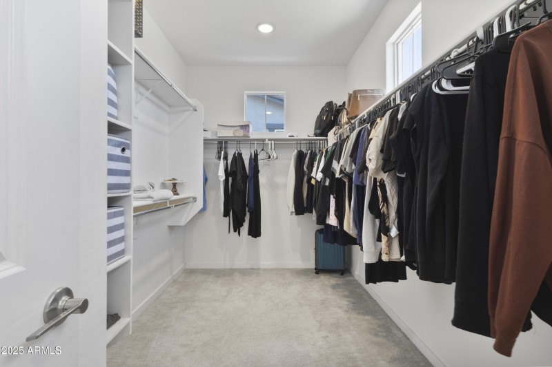 Primary walk-in closet.