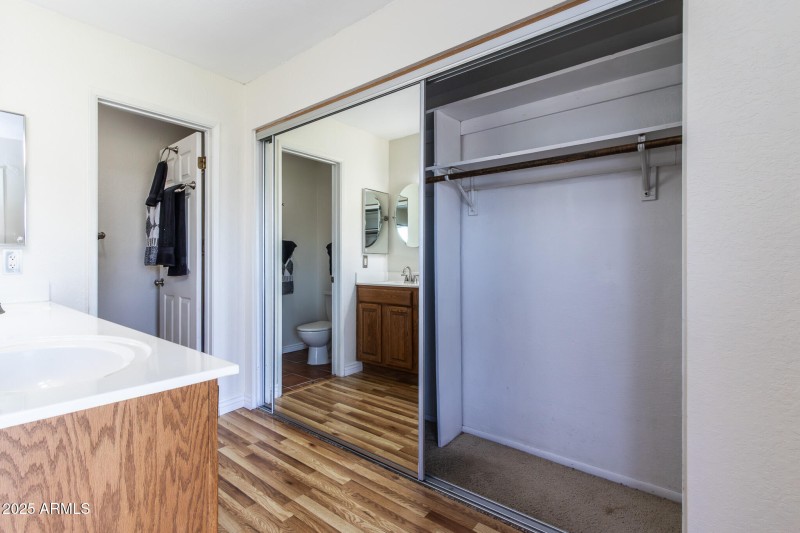 Half of the large Primary room closet