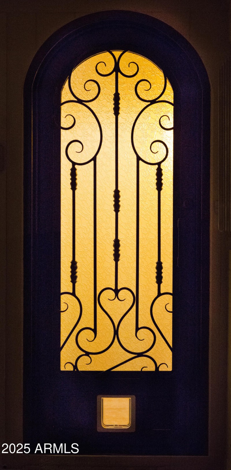 Pat's side Iron Door at night yellow lig