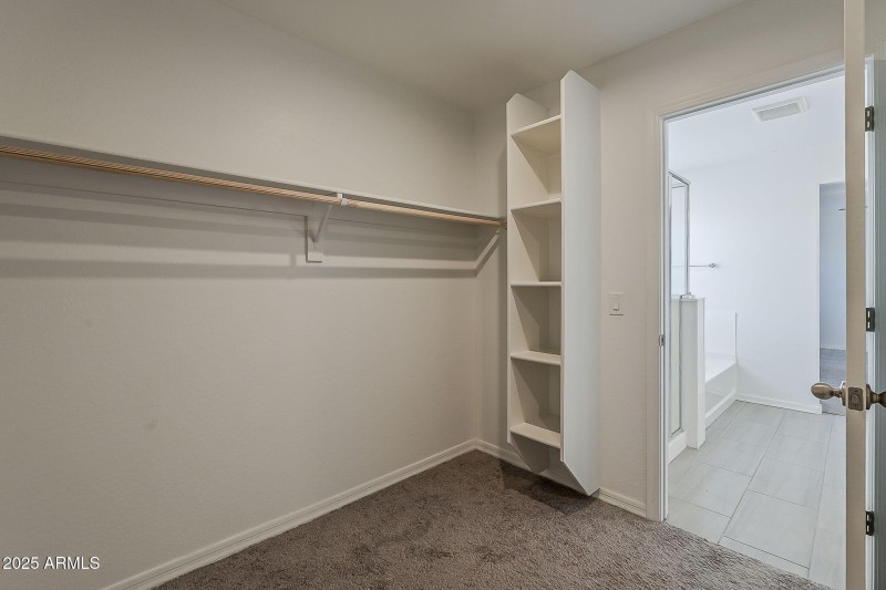 Walk-In Closet with Built-In Shelving