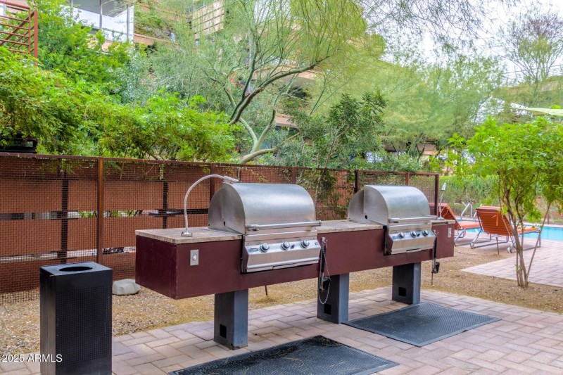 Community grills by outdoor pool