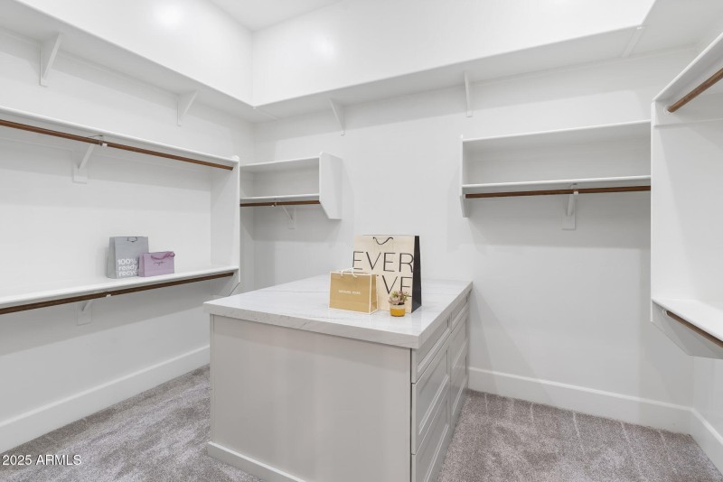 His and hers large walk ins