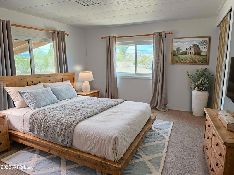 12 Virtually staged primary bedroom Stan