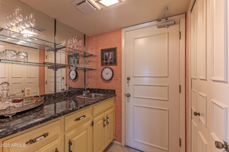 Wet bar between kitchen and living room