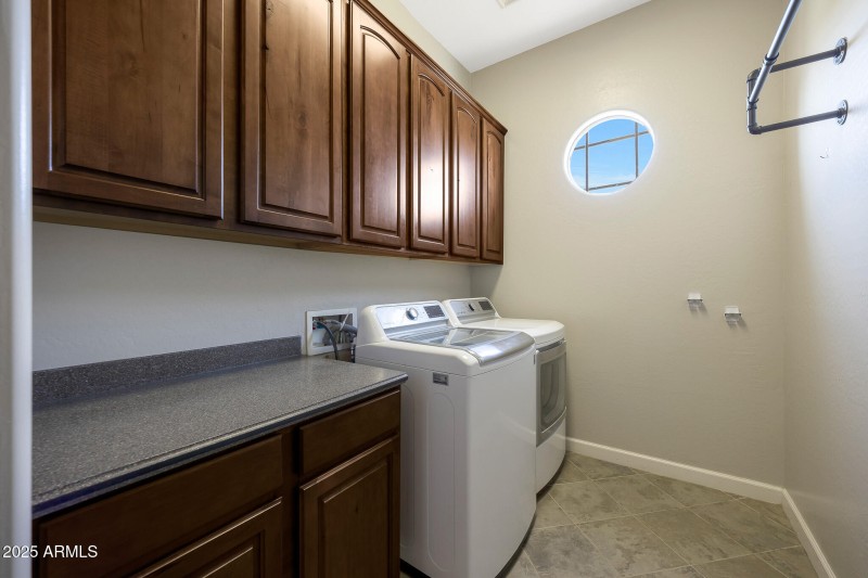 Walk in laundry room with storage