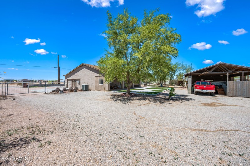 Driveway to carport in rear