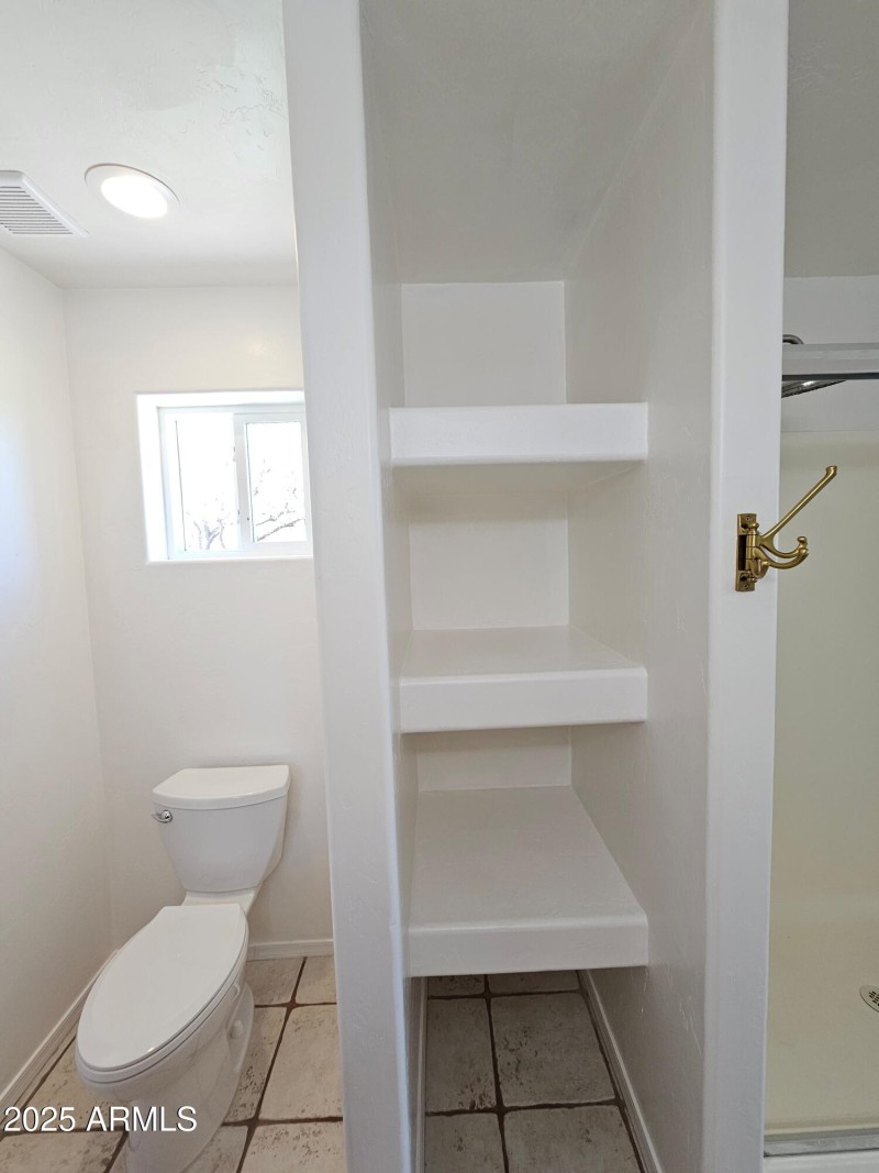 primary bath storage and commode