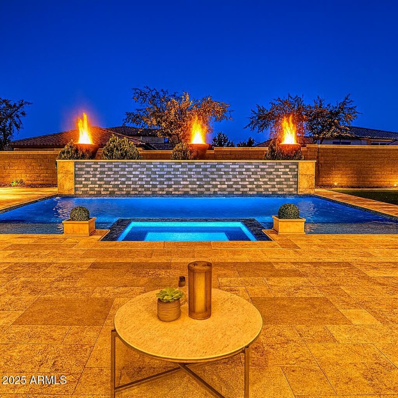 fire woks ontop of pool wall