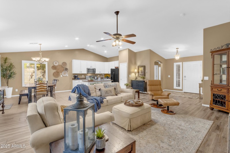 Living room opens to kitchen and dining