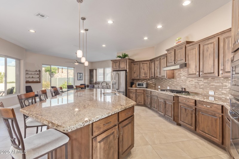 With an expansive island/breakfast bar