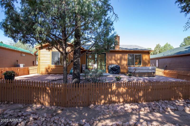 Backyard fenced w trees