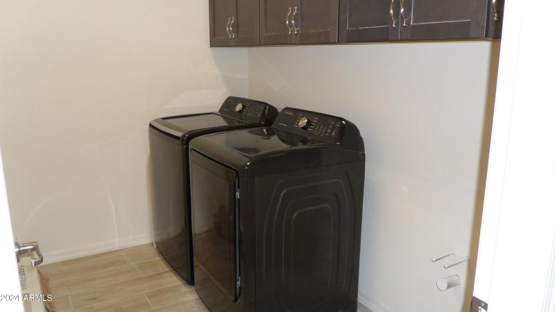 INSIDE LAUNDRY ROOM W/ WASHER AND DRYER