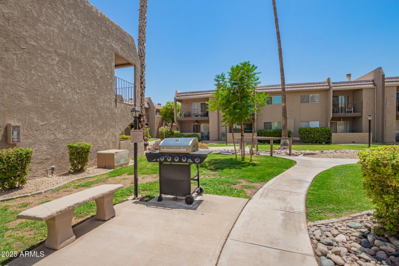 green space all around with BBQ's