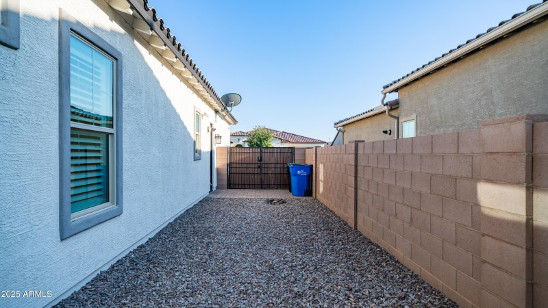 Gravel sideyard with double gate