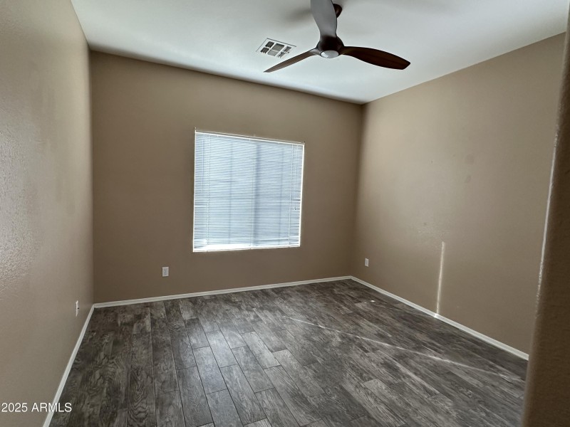 Bedroom 2 with fan and blinds