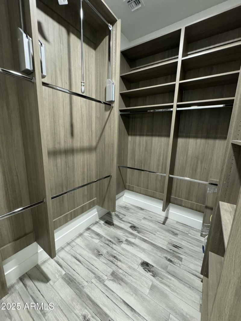 Master closet with pull down wardrobe