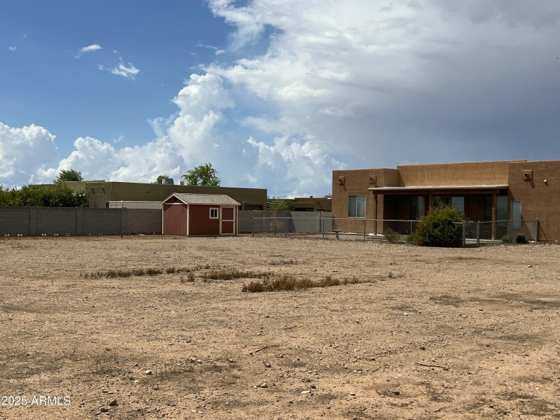 Back of home w/ shed