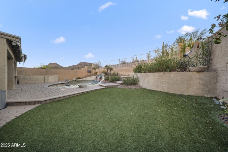 Landscaped Yard with Artificial Turf