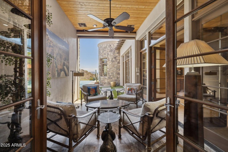 Sunroom with shades up & access to two h