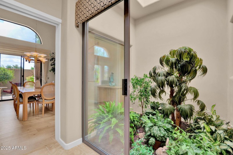 Atrium full of light to kitchen