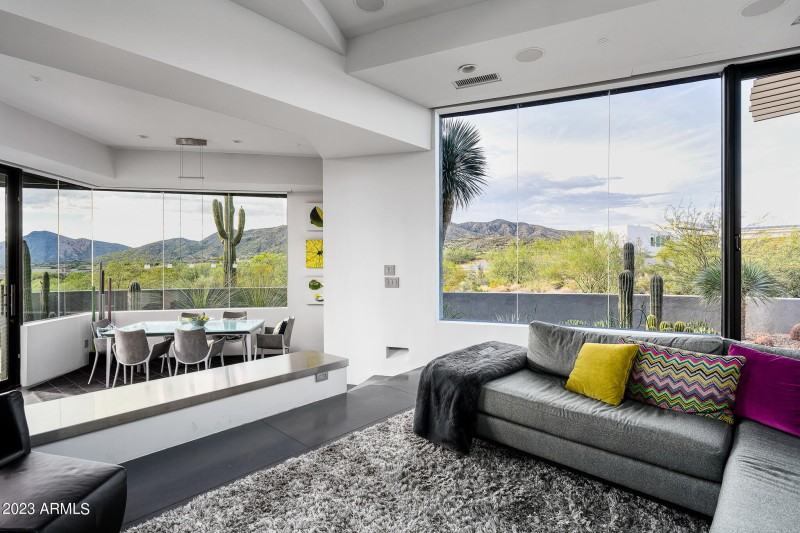 Den off of kitchen with views