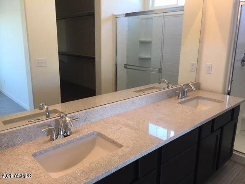 Primary bathroom with double sinks.
