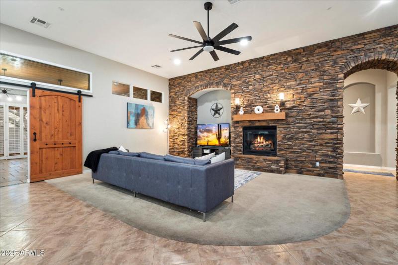 Living Room w/ Stone Accented Fireplace