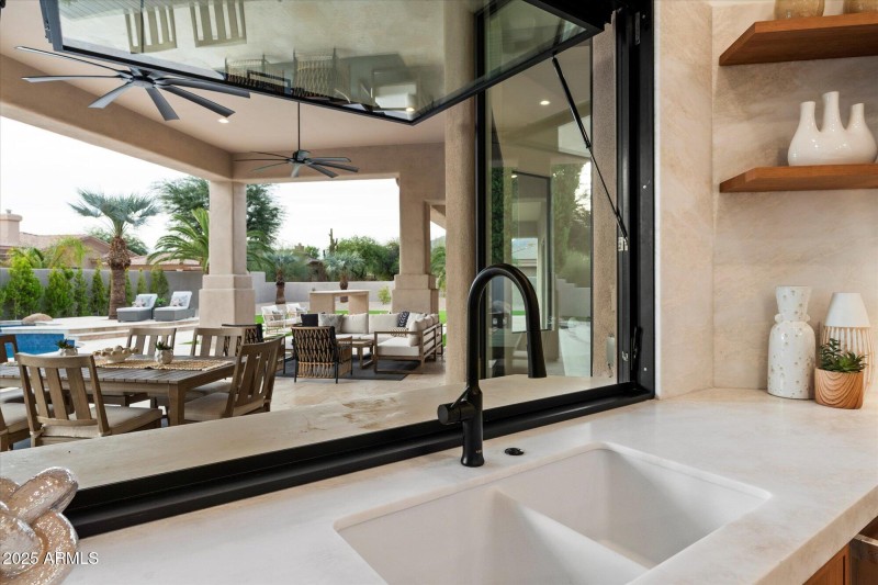 Fully opening service window to patio