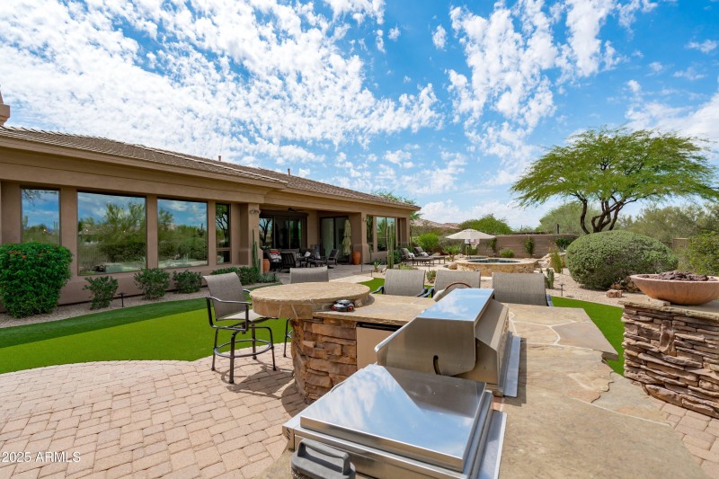 74-BBQ and Fireplace Area to Pool