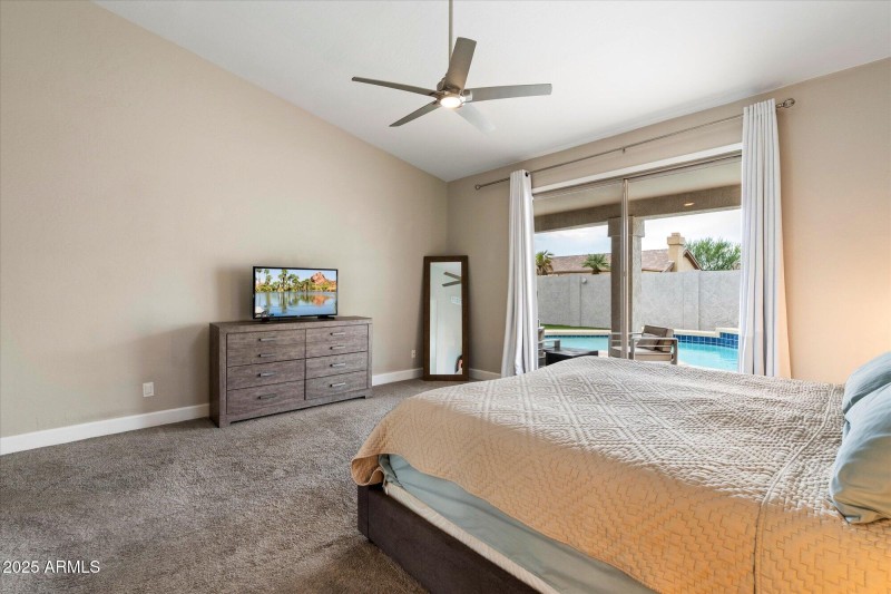 Primary Bedroom with Sliders out to Pool