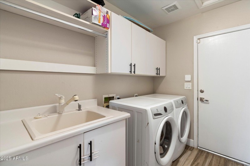 Laundry Room with Utility Sink to Garage