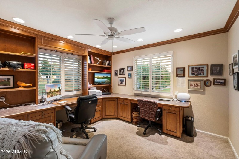 Office with built in desk and shelving
