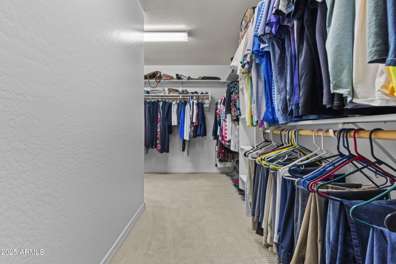 Enormous primary walk-in closet