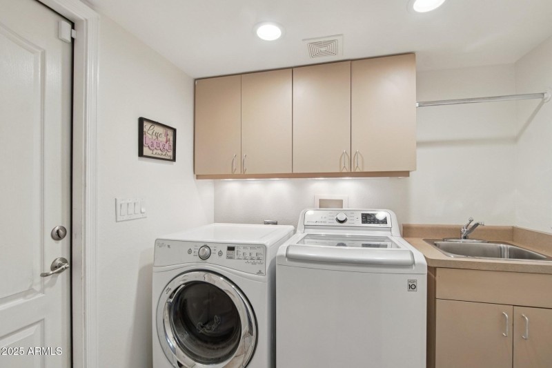Laundry w/ sink, cabinets & ironing ctr